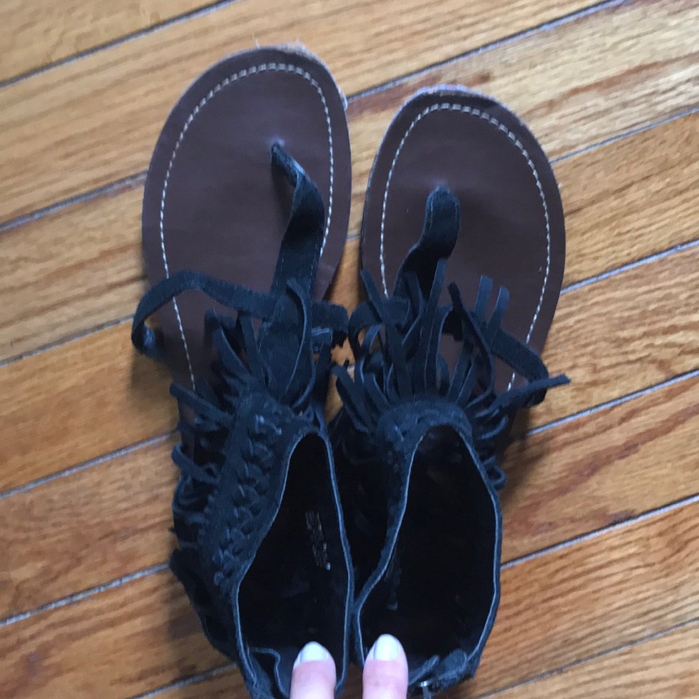 Minnetonka black sandals with fringe